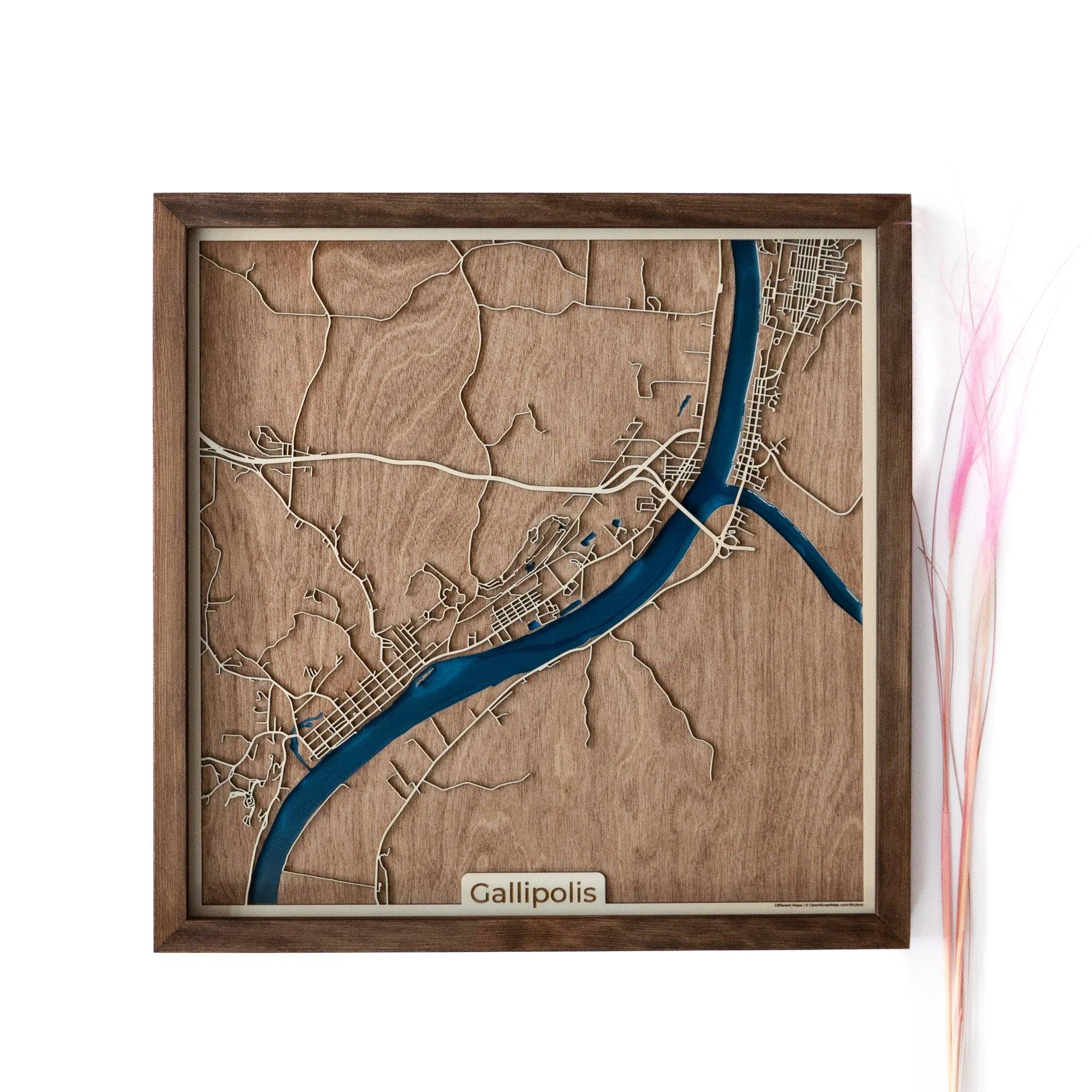 A wooden map of Gallipolis, featuring a stunning blue multi-toned resin design in the water reservoir. This exquisite wooden map serves as the perfect gift for admirers of Gallipolis, whether they are residents, visitors, or those with a special connection to this charming city. With its intricate craftsmanship and unique beauty, it is an ideal gift for any occasion. #woodenmap #Gallipolis #resinart #perfectgift