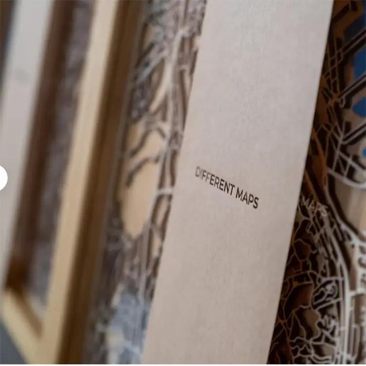 Close-up of custom wooden maps with epoxy resin, showcasing intricate craftsmanship and engraved details for unique decor.