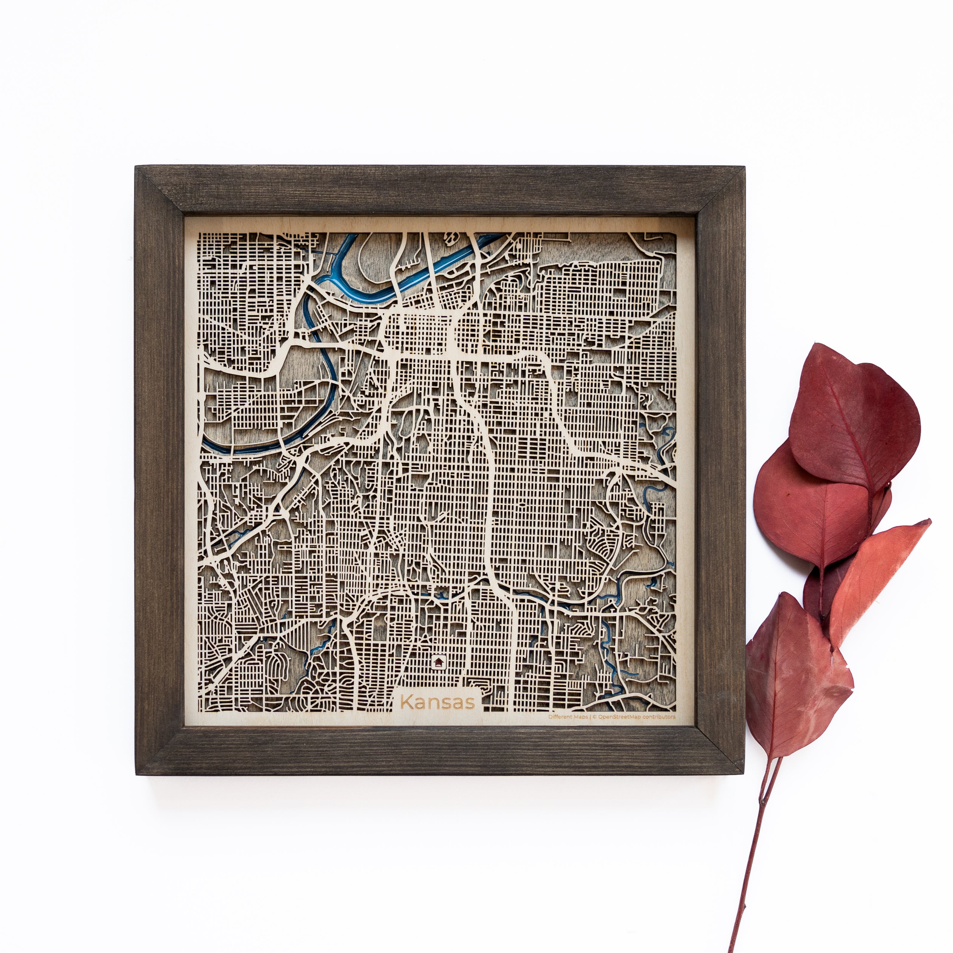 Unveil the charm of Kansas City with our intricately detailed wooden map, capturing the essence of its streets, landmarks, and waterways.