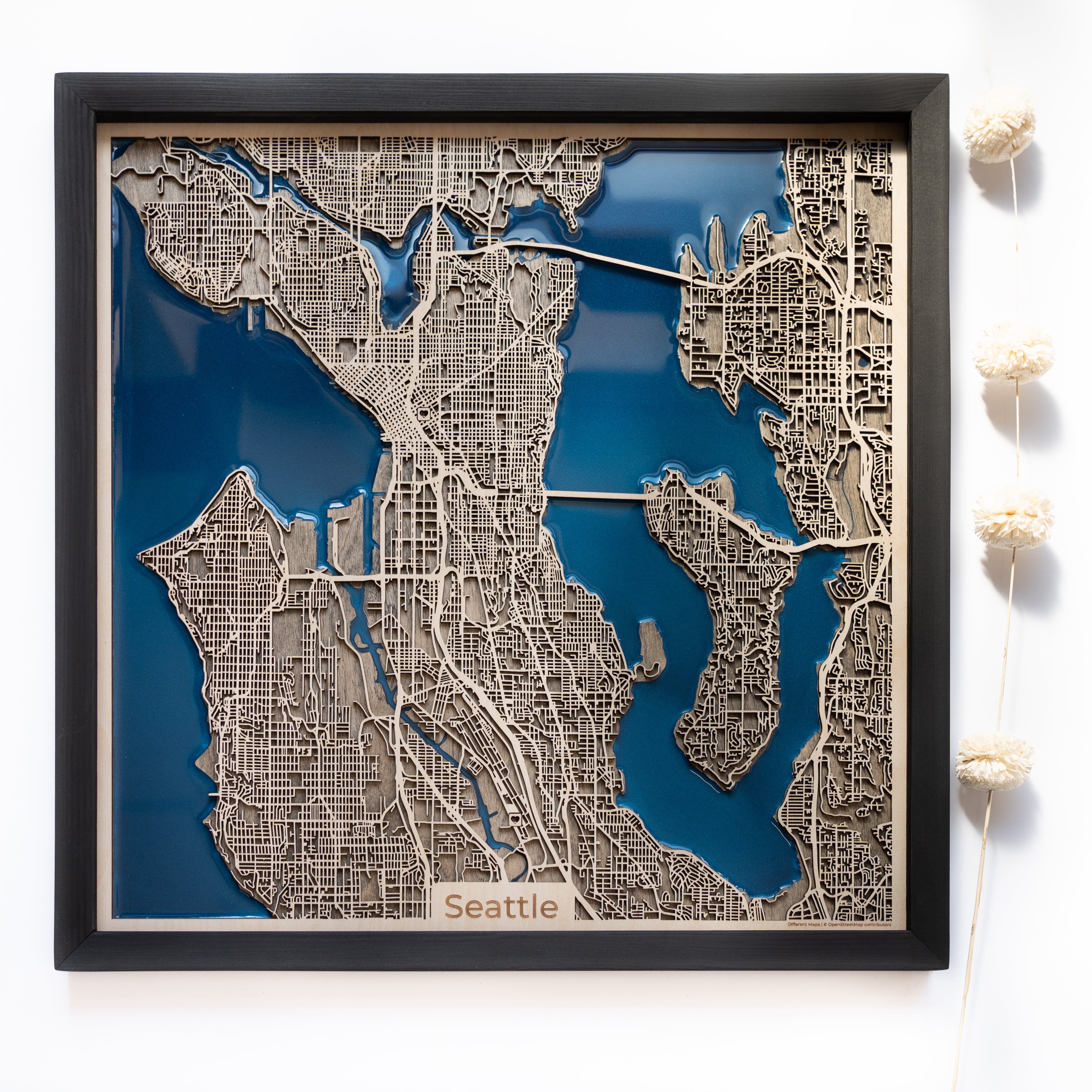 Discover the allure of Seattle with our wooden map. From the iconic Space Needle to the bustling streets of Pike Place Market, this map beautifully showcases the vibrant spirit and diverse landmarks of the Emerald City. Perfect for home or office decor.